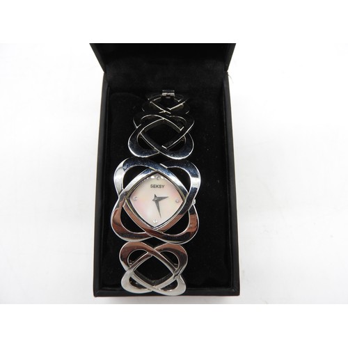 575 - MODERN SEKSY WATCHLadies boxed Seksy bracelet watch with mother of pearl dial. The bracelet with gra... 