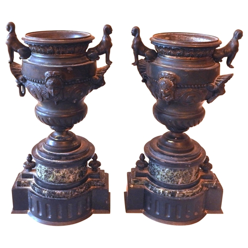 591 - A PAIR OF LATE 19TH CENTURY NEO CLASSSICAL CAST METAL URNS, campagna form decorated in low relief wi... 