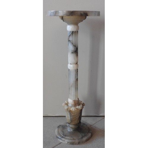 67 - A MARBLE TORCHERE/URN STAND, LATE 19TH/EARLY 20TH CENTURY, the circular top on a fluted column suppo... 