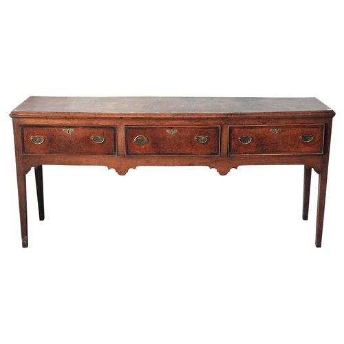 108 - A GEORGE III OAK AND MAHOGANY CROSS BANDED DRESSER BASE, moulded edge rectangular top above three fr... 