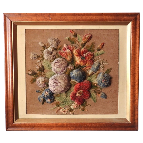 411 - A VICTORIAN EMBROIDERED PANEL IN HIGH RELIEF, depicting an abundant floral spray with blossoming ste... 