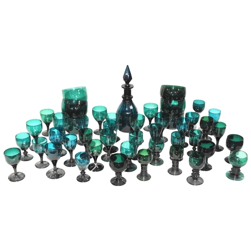 302 - A LARGE GROUP OF BRISTOL GREEN GLASS WARE, 18TH/19TH CENTURY, the lot comprised of a faceted decante... 