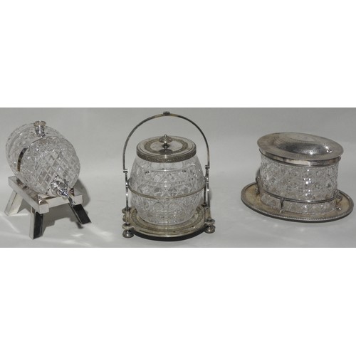 296 - A VINTAGE CUT GLASS SPIRIT BARREL ON A SILVER PLATED STAND, along with two vintage cut glass biscuit... 