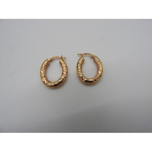 577 - A PAIR OF ITALIAN 14CT GOLD HOOP EARRINGS, oval form with a planished finish, marked '585' and 'Ital... 