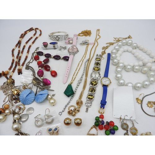 568 - A SELECTION OF COSTUME JEWELLERY, including bead necklaces, pendants, earrings, brooches and four wr... 