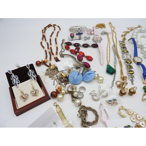 568 - A SELECTION OF COSTUME JEWELLERY, including bead necklaces, pendants, earrings, brooches and four wr... 