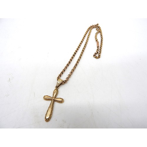 583 - A 9CT GOLD CRUCIFIX PENDANT AND CHAIN, the crucifix with chased scroll work edgesChain 40 cm longCom... 