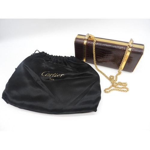 259 - CARTIER NAVY CURVED CLUTCH BAG WITH GILT CHAIN HANDLES WITH AN ITALIAN LEATHER MOCK CROC HARD CASE S... 