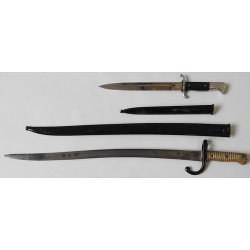 210 - A FRENCH CHASSEPOT SWORD BAYONET AND A GERMAN SECOND WORLD WAR DRESS BAYONET, the blade of the Frenc... 