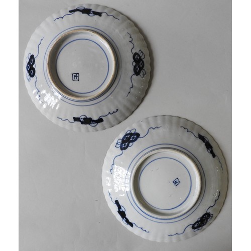 266 - A PAIR OF JAPANESE IMARI DISHES, scallop form with painted flower basket decoration31 cm diam