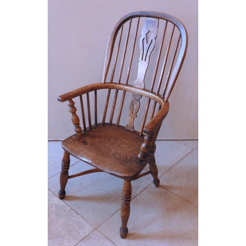 50 - A GROUP OF THREE NEAR MATCHED EARLY 19TH CENTURY WINDSOR CHAIRS, all with pierced splats over elm sa... 