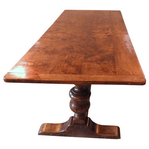 83 - AN 18TH CENTURY OAK REFECTORY TABLE, the two plank rectangular top raised on baluster turned end sup... 