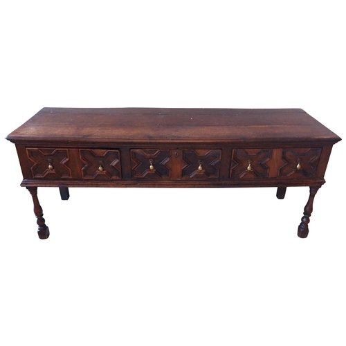 85 - AN OAK GEORGE III OAK DRESSER BASE, CIRCA 1760, the long rectangular moulded edge top over three fri... 