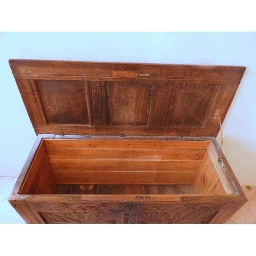 87 - A CHARLES II OAK PANELLED COFFER, CIRCA 1655, the hinged rectangular top inscribed with the date 165... 