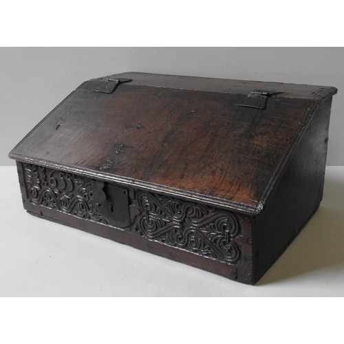 97 - A CHARLES II OAK BIBLE BOX, CIRCA 1655, the frieze panel carved with scroll foliate decoration and t... 