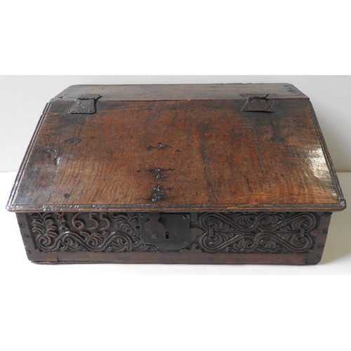 97 - A CHARLES II OAK BIBLE BOX, CIRCA 1655, the frieze panel carved with scroll foliate decoration and t... 