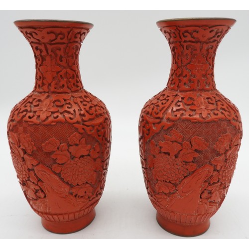 286 - A PAIR OF CINNABAR LACQUER ENAMELLED VASES, simple baluster form, the sides decorated with blossomin... 