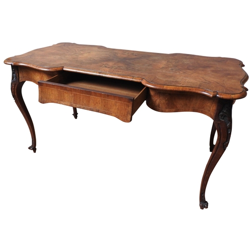 6 - A FRENCH WALNUT BUREAU PLAT, LATE 19TH CENTURY, crossbanded scroll edge rectangular top above an ele... 