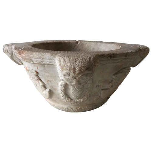 622 - A MARBLE MORTAR, THE LUGS CARVED AS LIONS WITH RINGS OF WREATHS IN THEIR MOUTHS, and interspersed wi... 