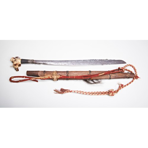 211 - A GOOD DAYAK MANDAU SWORD the fine deer antler hilt with coloured fibre tufts the forged iron blade ... 