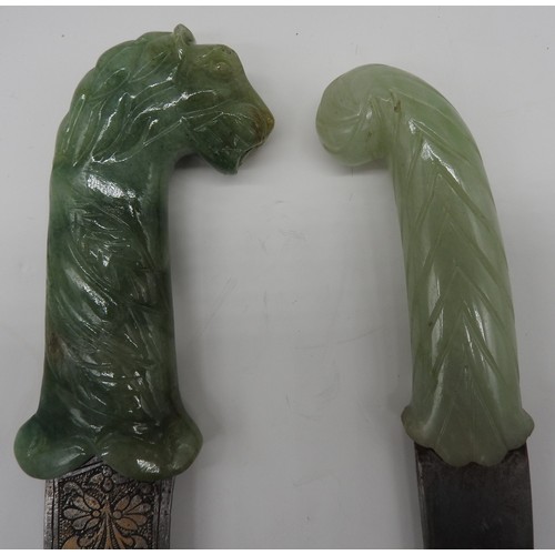 214 - AN INDIAN STEEL DAGGER WITH NEPHRITE LION'S HEAD HANDLE AND ANOTHER WITH A CURVED HANDLE. 20th centu... 