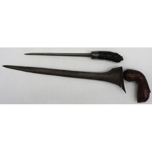 202 - AN INDONESIAN KRIS WITH WATERED STEEL WAVY BLADE WITH HARDWOOD HULU AND WARANGKA and an Indonesian t... 