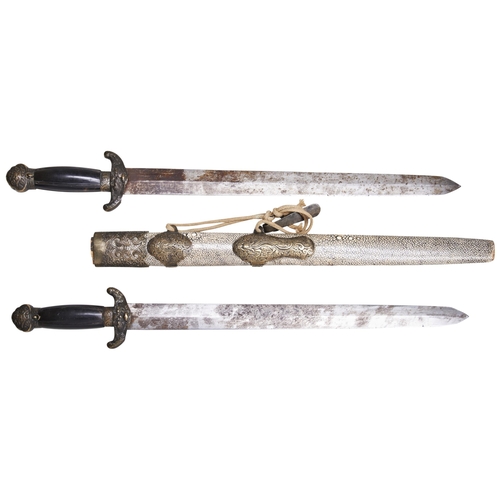 201 - A CHINESE DOUBLE SWORD WITH STEEL BLADES, HORN HILTS, BRASS MOUNTS AND SHARK SKIN COVERED SCABBARD.6... 