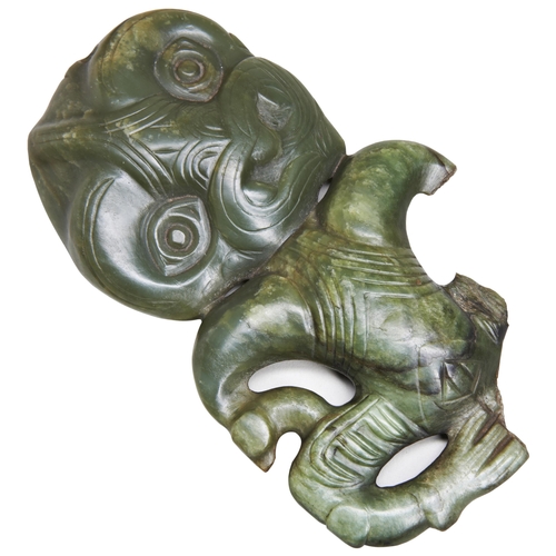 A LARGE MAORI NEPHRITE HEI TIKI in human form carved on one side. 