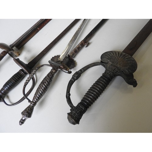 194 - A FRENCH SMALL SWORD WITH ORNATELY CAST HILT and steel scabbard, two other small swords And a 19th c... 