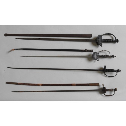 194 - A FRENCH SMALL SWORD WITH ORNATELY CAST HILT and steel scabbard, two other small swords And a 19th c... 