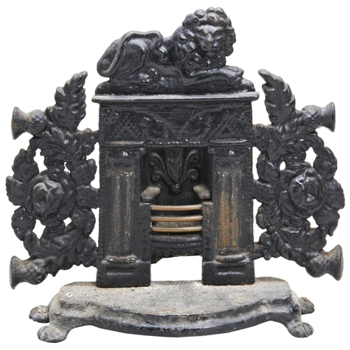 605 - A VICTORIAN CAST IRON DOORSTOP IN THE FORM OF A FIREPLACE, THE GRATE WITH BRASS BARS.32 x 33cmsProve... 