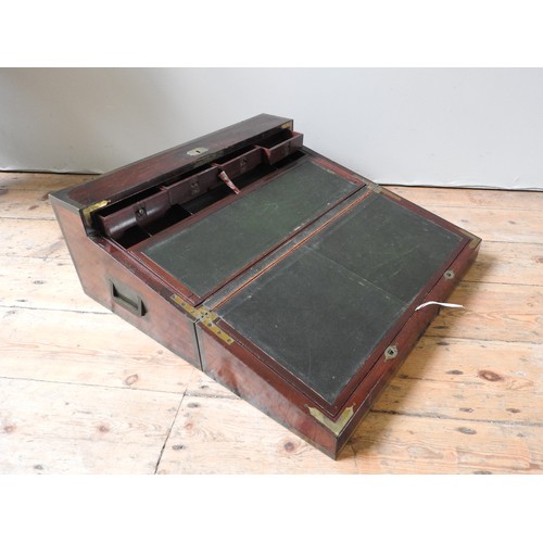 484 - A LARGE BRASS BOUND MAHOGANY CAMPAIGN WRITING SLOPE with a lift out interior revealing an arrangemen... 