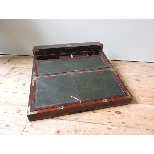 484 - A LARGE BRASS BOUND MAHOGANY CAMPAIGN WRITING SLOPE with a lift out interior revealing an arrangemen... 