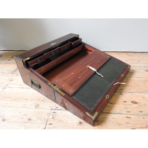 484 - A LARGE BRASS BOUND MAHOGANY CAMPAIGN WRITING SLOPE with a lift out interior revealing an arrangemen... 