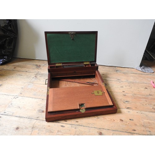 482 - A MAHOGANY BRASS BOUND CAMPAIGN WRITING SLOPE  the lid initialled on a brass plaque, ‘MJC’. In need ... 