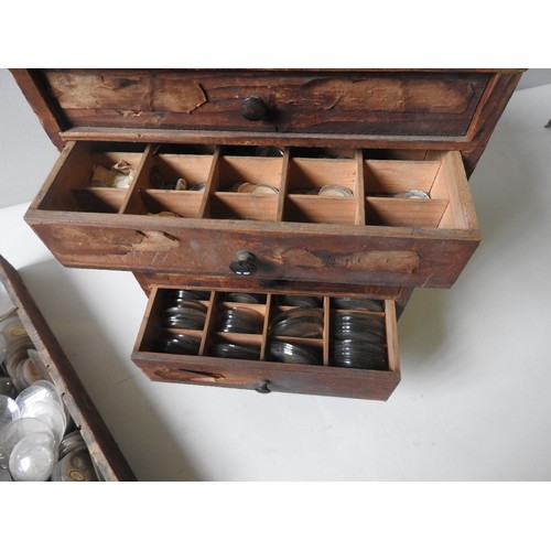 140 - A PINE 5 DRAWER BOX and a single draw box containing a large quantity of watch glasses (qty)Provenan... 