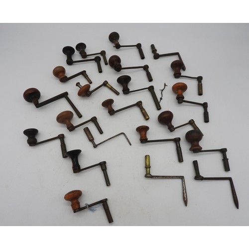 138 - 22 CRANK WINDING KEYS most with wooden handles (22)Provenance:from the Private Collection of the Lat... 