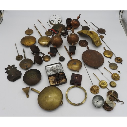 133 - A QUANTITY OF CLOCK ITEMS. English and French pendulums, bells, finials etc. (qty)Provenance:from th... 