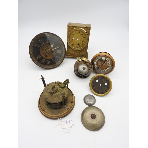 129 - FOUR FRENCH MOVEMENTS. One with silk suspension, a silvered dial with bezel and a section of case wi... 