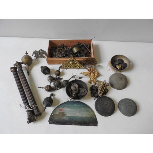 134 - A BOX CONTAINING LONGCASE ITEMS. Bells, pulleys, spandrels, finials, a pair of fluted corinttian col... 