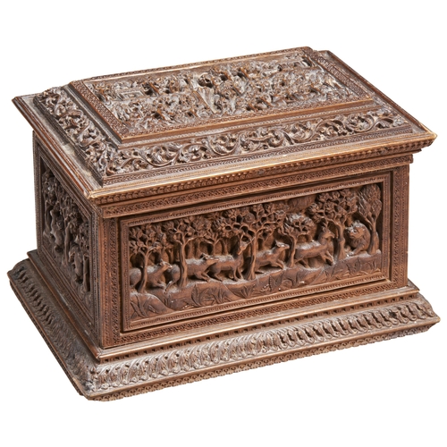 680 - A FINELY CARVED INDIAN TABLE CASKET, the lid decorated with scenes of figures and animals in a lands... 