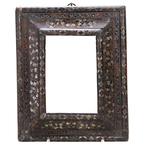 659 - A CONTINENTAL 17TH CENTURY FRAME, the tortoiseshell veneer inlaid with metal floral decoration and a... 