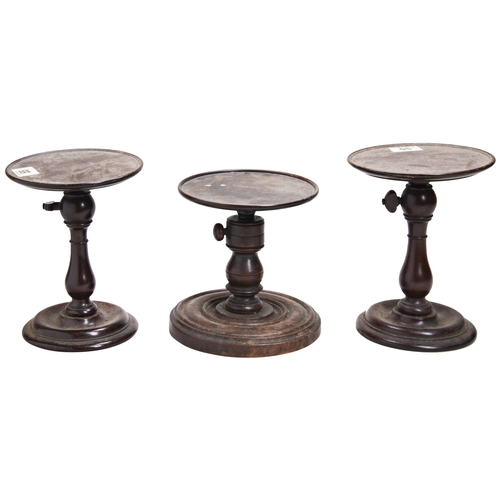 663 - A GEORGIAN ADJUSTABLE FRUITWOOD CANDLE STAND AND TWO OTHERS SIMILAR.17 cms shut maxProvenance:from t... 