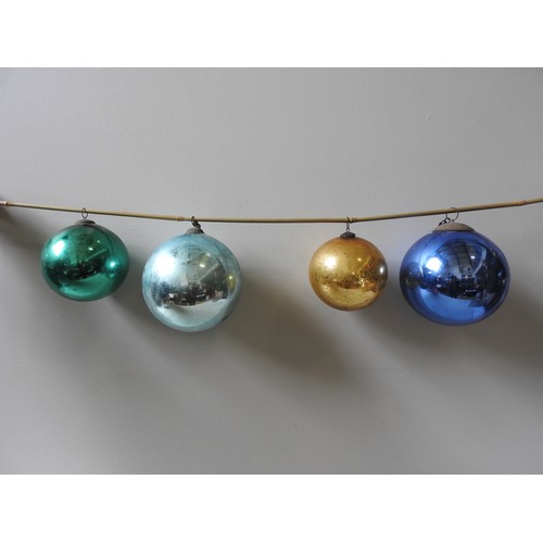 648 - A BLUE 'WITCHES' BALL WITH SUSPENSION LOOP, ANOTHER IN LIGHTER BLUE AND TWO SMALLER IN GOLD AND GREE... 