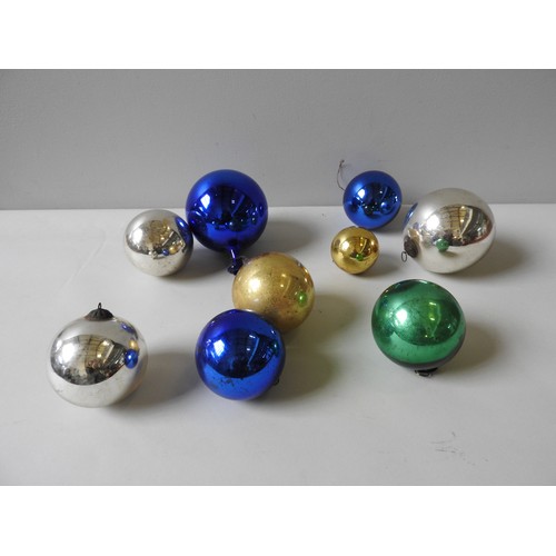 649 - A BLUE 'WITCHES' BALL WITH AN ELONGATED NECK AND EIGHT OTHERS SMALLER IN ASSORTED COLOURS.18 cms max... 