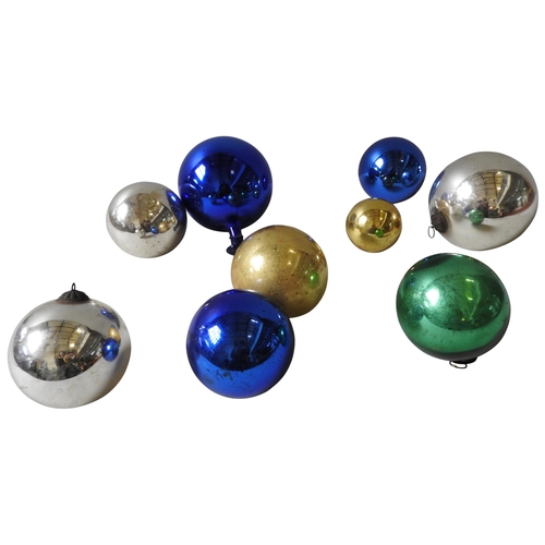 649 - A BLUE 'WITCHES' BALL WITH AN ELONGATED NECK AND EIGHT OTHERS SMALLER IN ASSORTED COLOURS.18 cms max... 