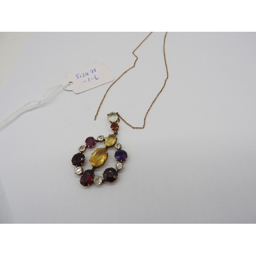 521 - AN EDWARDIAN GEM SET YELLOW METAL PENDANT set with amethyst, quartz and garnet. Chain broken.