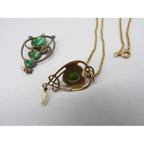 526 - AN EDWARDIAN 9CT PENDANT MARKED HM WITH A YELLOW METAL CHAIN AND AN ENAMELLED WHITE METAL PENDANT CI... 