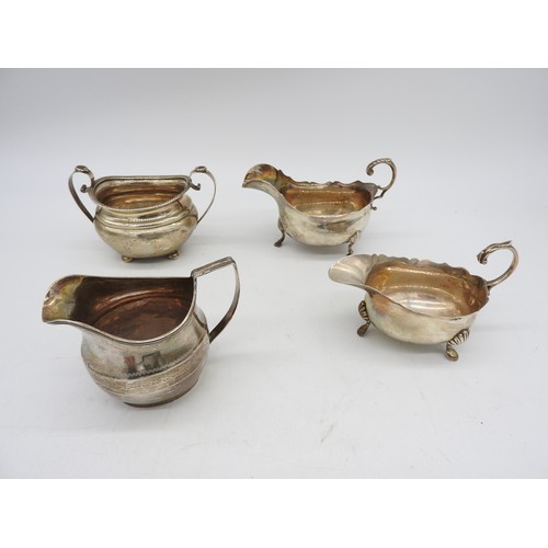 538 - TWO SILVER SAUCEBOATS, BOAT FORM JUG AND BOAT FORM SUGAR BOWL, the two sauceboats with scroll handle... 