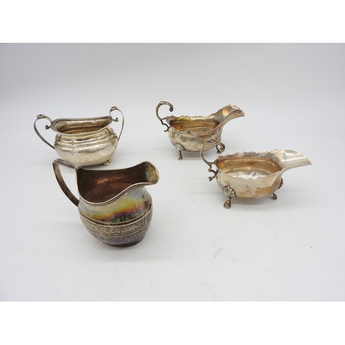 538 - TWO SILVER SAUCEBOATS, BOAT FORM JUG AND BOAT FORM SUGAR BOWL, the two sauceboats with scroll handle... 